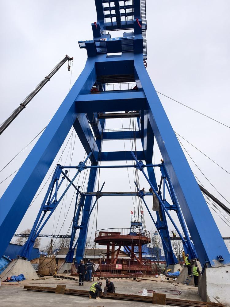 陕煤建设矿建二公司：创新工艺 永久井架套临时凿井井架施工提效保安全